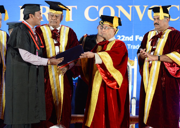 The President of India, Shri Pranab Mukherjee while presenting a degree to the student at the Convocation of Indian Maritime University at Chennai Trade Centre at Chennai in Tamil Nadu onFebruary 22, 2014. Also seen are the Governor of Tamil Nadu, Shri K. 