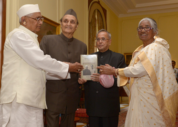 The President of India Shri Pranab Mukherjee receiving the first copy of a book “Hashiye Se Mukhyadhara Tak” written by the Governor of Haryana, Shri Jagannath Pahadia at Rashtrapati Bhavan in New Delhi on March 28, 2014. The President received the book f 