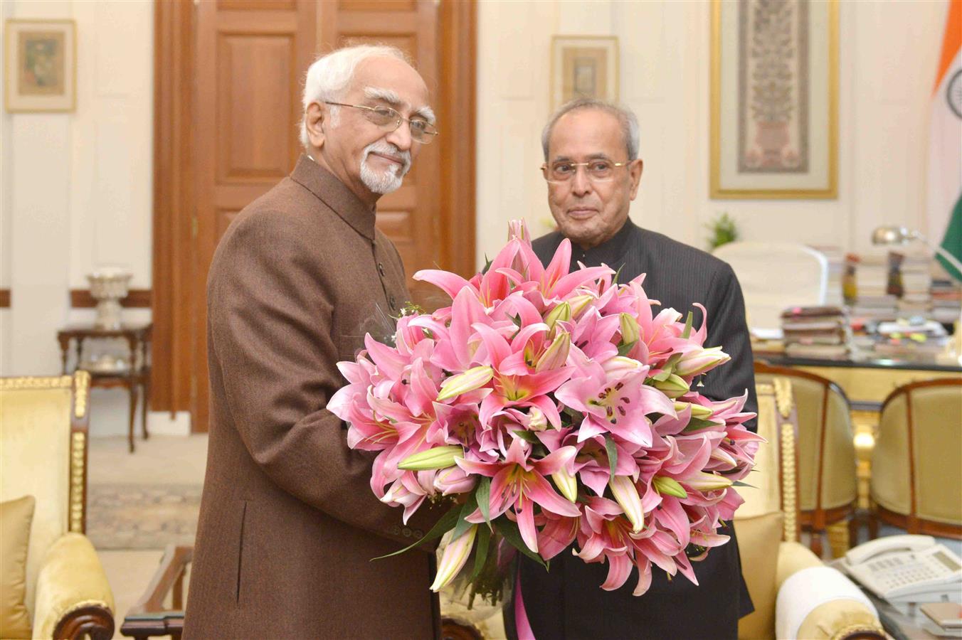 The President of India, Shri Pranab Mukherjee meeting with Shri Mohd. Hamid Ansari, Vice President of India on the occasion of New Year at Rashtrapati Bhavan on January 1, 2016. 