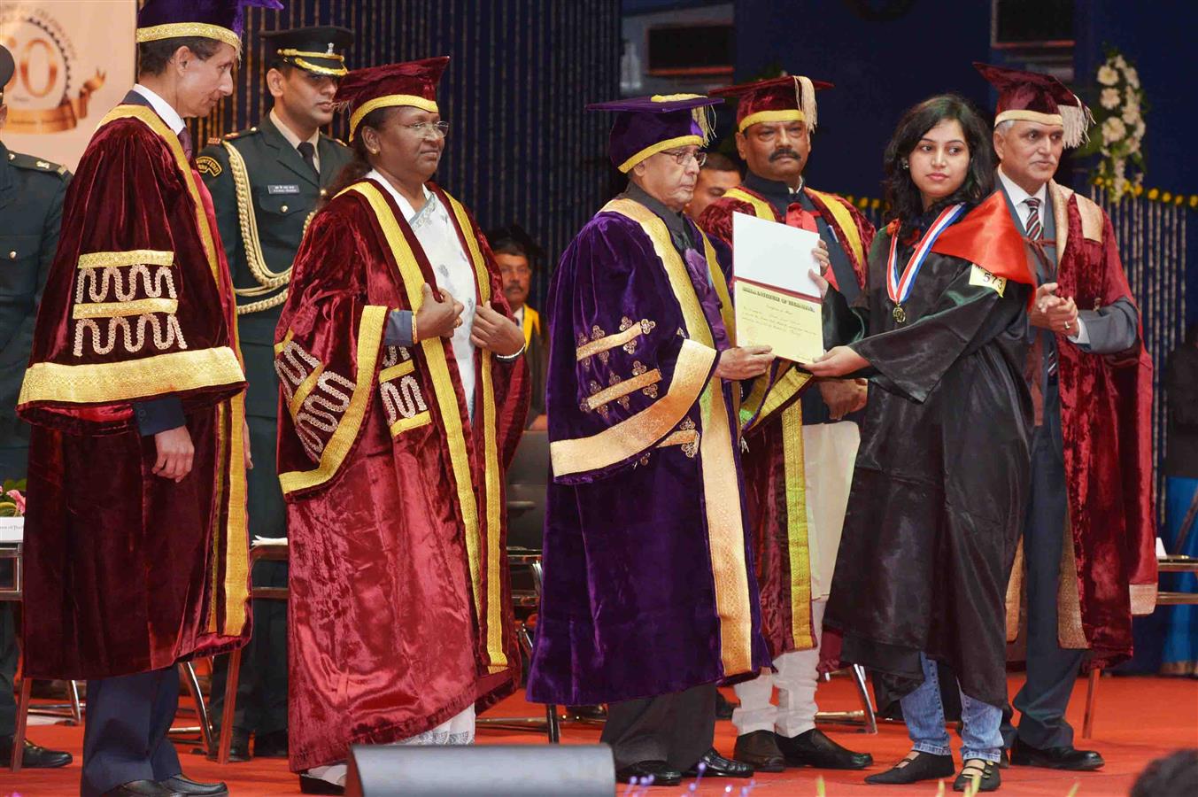 The President of India, Shri Pranab Mukherjee presenting the degree to a Student at the Diamond Jubilee Celebration and Convocation of Birla Institute of Technology at Ranchi in Jharkhand January 10, 2016. 