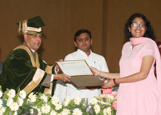 The President of India, Shri Pranab Mukherjee while presenting a degree to the student at the Fourth Convocation of Babasaheb Bhimrao Ambedkar University (BBAU) at Lucknow in Uttar Pradesh on May 10. 2013. Also seen is the Chief Minister of Uttar Pradesh