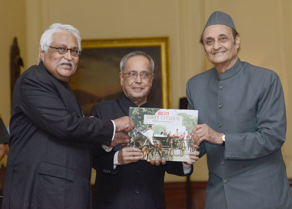 The President of India, Shri Pranab Mukherjee receiving the first copy of a coffee-table book titled ‘First Citizen: Pranab Mukherjee from Dr. Karan Singh in the presence of the President and Managing Editor of the Week, Mr. Philip Mathew at Rashtrapati B 