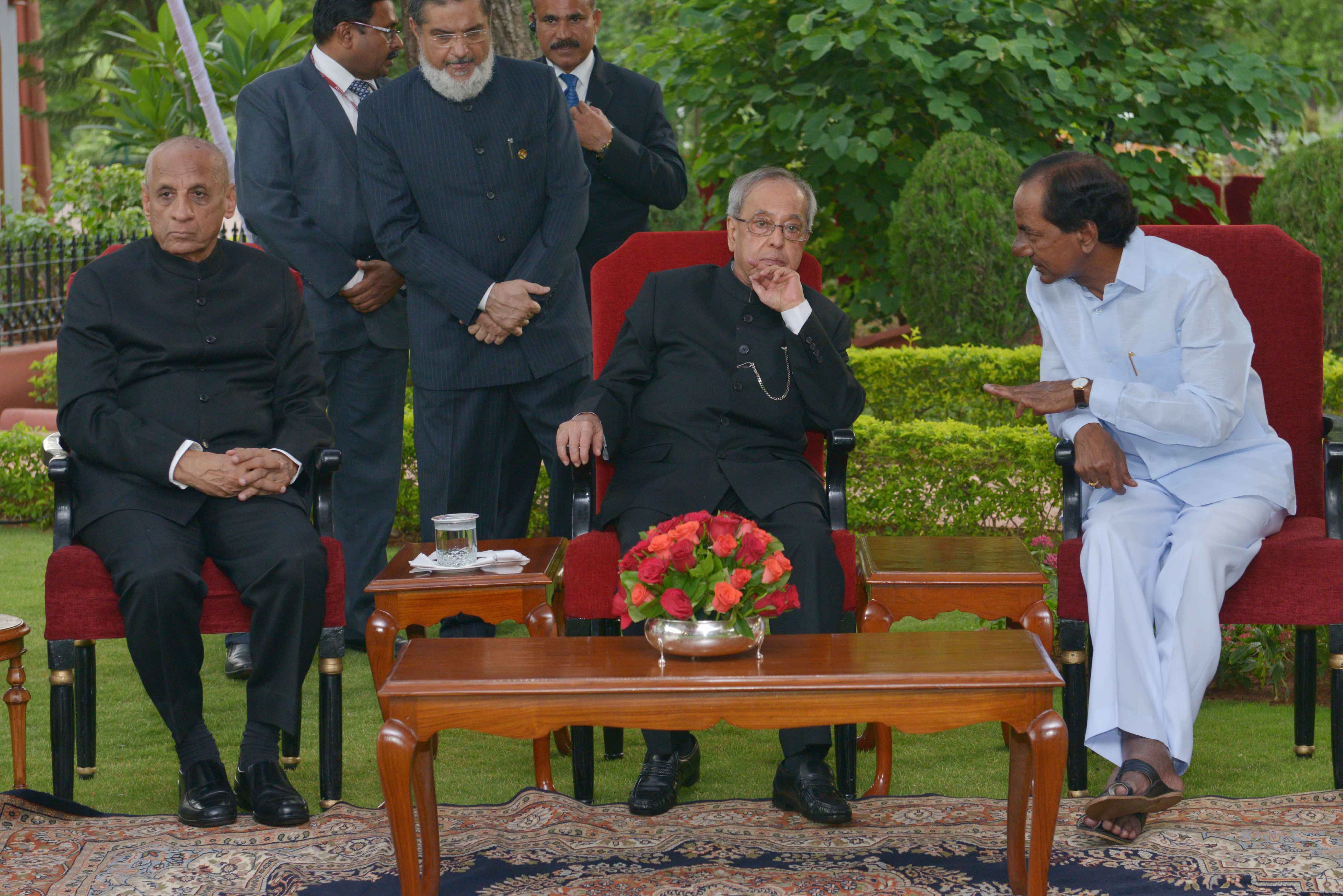 The President of India, Shri Pranab Mukherjee, Governor of Telangana and Andhra Pradesh, Shri ESL Narasimhan and the Chief Minister of Telangana, Shri K Chandrasekhar Rao during the Reception hosted by him at Rashtrapati Nilayam, Bolarum in Telangana on J