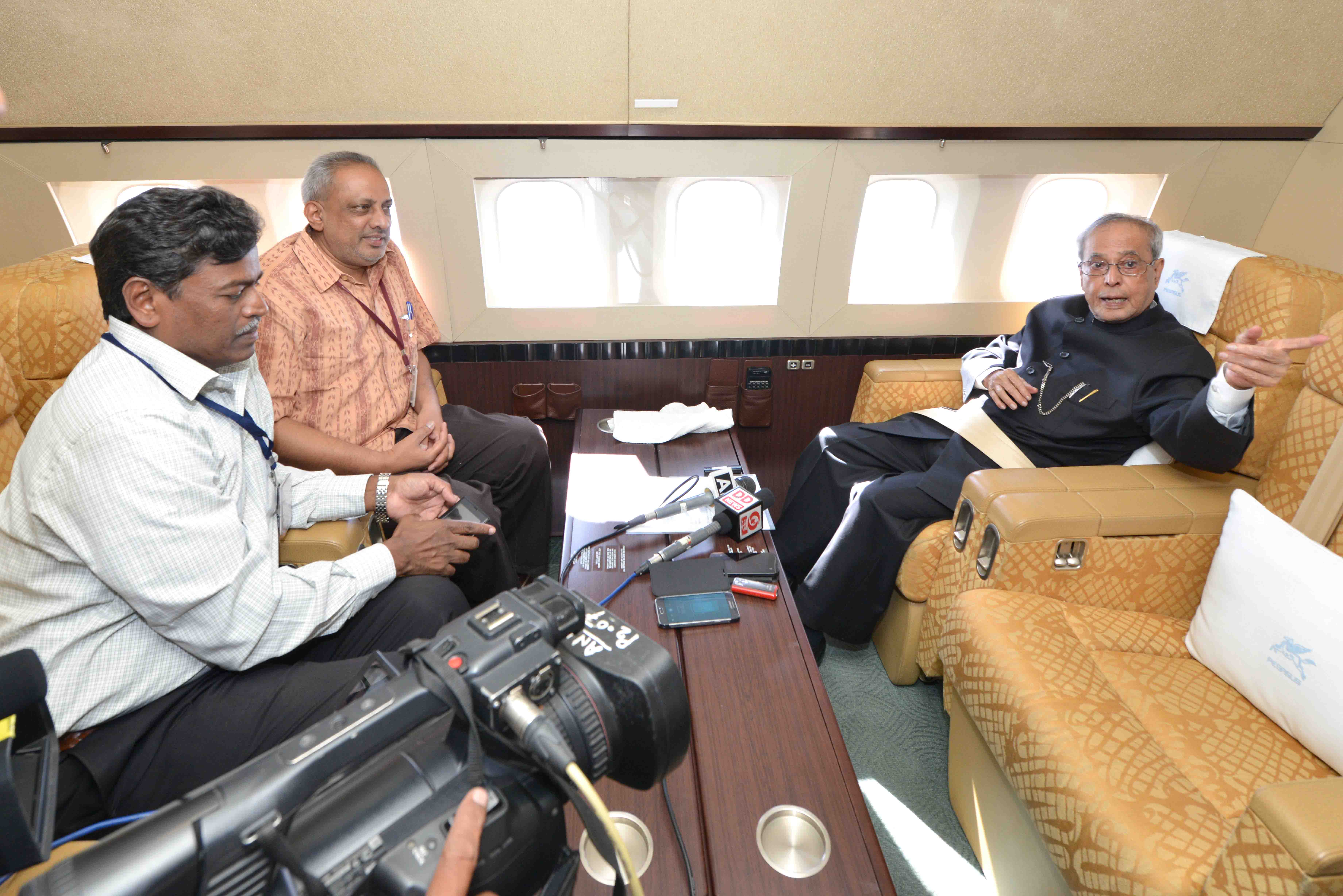 The President of India, Shri Pranab Mukherjee interacting with media persons on board aircraft on his way back to New Delhi from Karnataka on July 28, 2015.