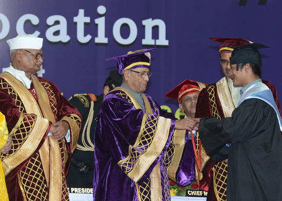 The President of India, Shri Pranab Mukherjee while presenting a degree to the student at the first convocation of Indira Gandhi National Tribal University (IGNTU) at Amarkantak in Madhya Pradesh on June 7, 2013. Also seen is the Governor of Madhya Prades