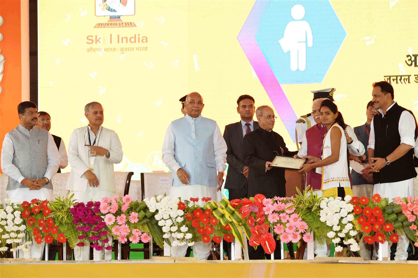 The President of India, Shri Pranab Mukherjee distributing Certificates to Successful Students/Trainees at the Foundation Stone Laying of a Driver’s Training Institute and a Secondary School under the Smart-Gram Initiative at village Dhaula in Gurugram,