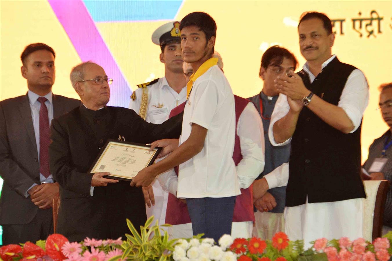 The President of India, Shri Pranab Mukherjee distributing Certificates to Successful Students/Trainees at the Foundation Stone Laying of a Driver’s Training Institute and a Secondary School under the Smart-Gram Initiative at village Dhaula in Gurugram, H