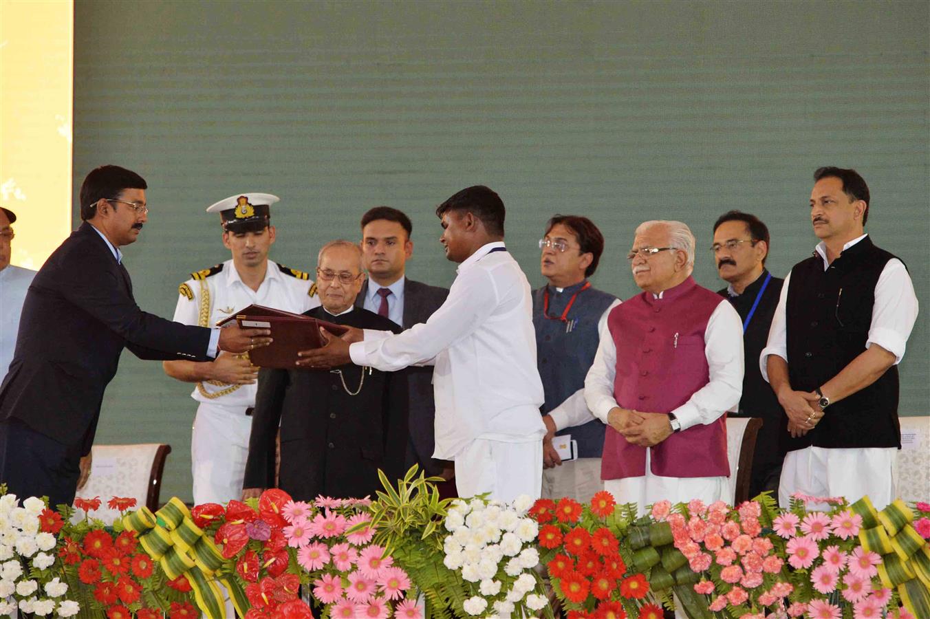 The President of India, Shri Pranab Mukherjee witnessing the exchange of MoUs at the Foundation Stone Laying of a Driver’s Training Institute and a Secondary School under the Smart-Gram Initiative at village Dhaula in Gurugram, Haryana on June 2, 2017.