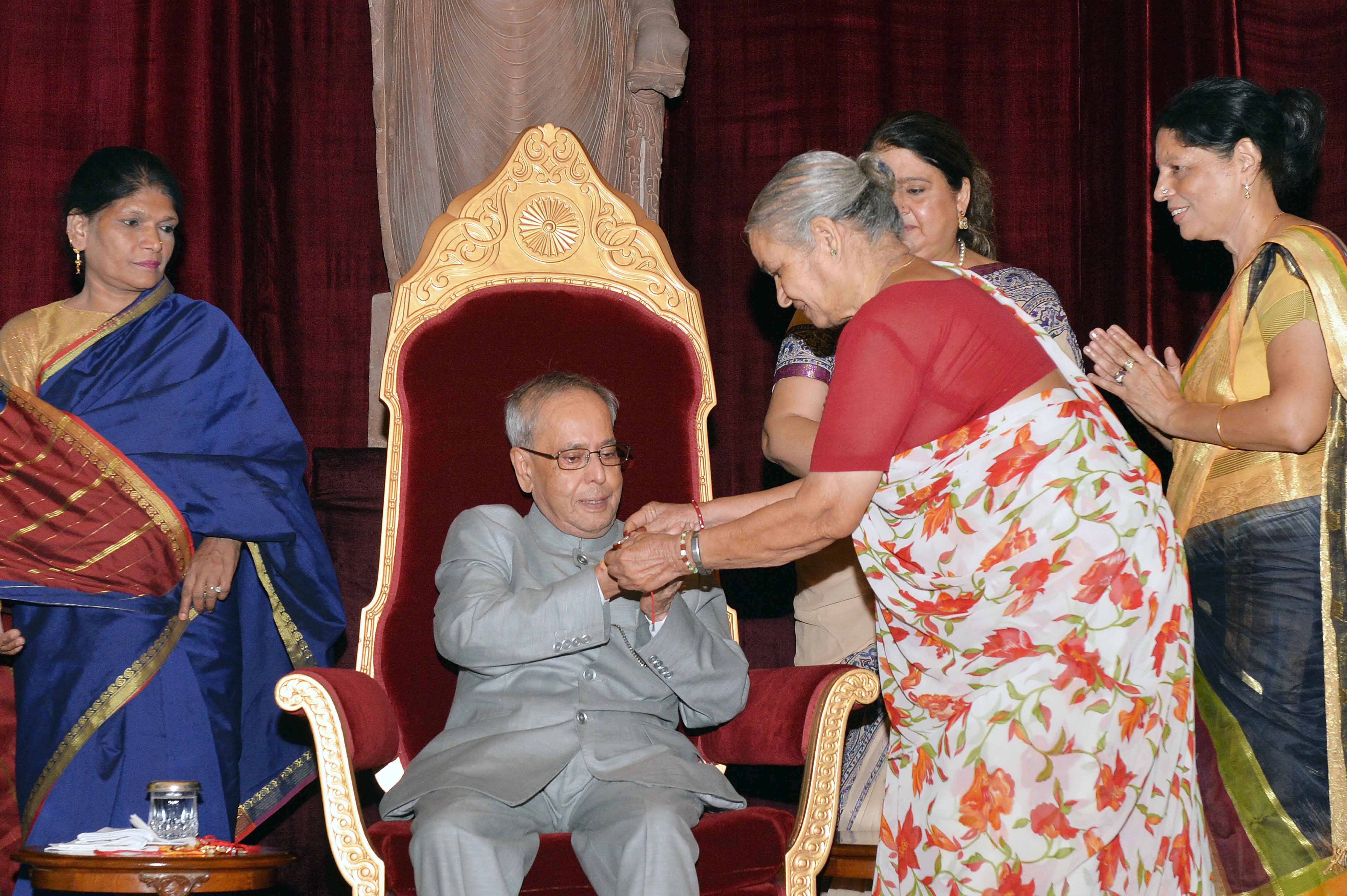 Women tying 'Rakhi' on the President of India, Shri Pranab Mukherjee at Rashtrapati Bhavan on August 29, 2015 on the occasion of Raksha Bandhan.