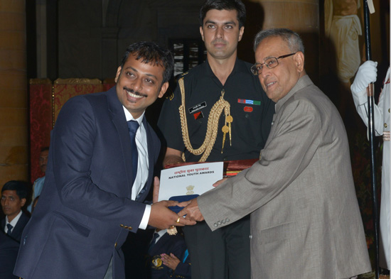 The President of India, Shri Pranab Mukherjee while presenting a National Youth Award for the year 2011-12 at Rashtrapati Bhavan in New Delhi on July 4, 2013.