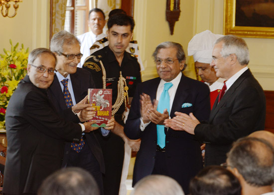 The President of India, Shri Pranab Mukherjee receiving a book entitled 'The New Bihar - Rekindling Governance and Development' from the Member of Parliament (RS), Shri N.K. Singh at Rashtrapati Bhavan in New Delhi on July 21, 2013.