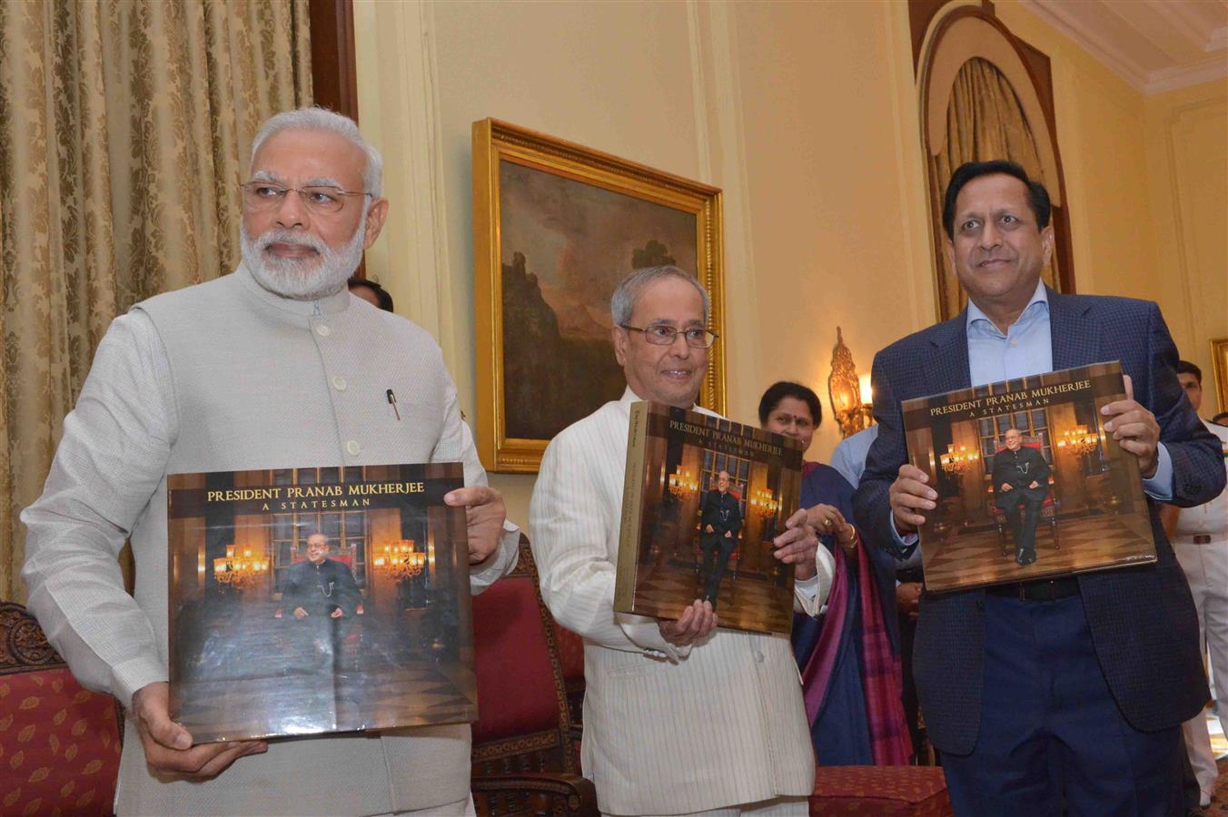 The President of India, Shri Pranab Mukherjee receiving the first copy of a book “President Pranab Mukherjee – A Statesman” from Prime Minister of India, Shri Narendra Modi who formally released it at Rashtrapati Bhavan on July 2, 2017.