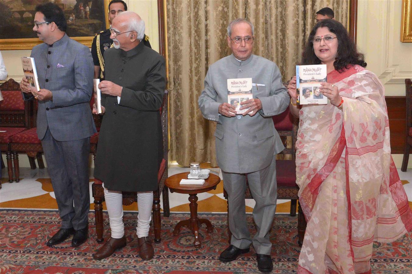 The President of India, Shri Pranab Mukherjee receiving the first copy of the book "President’s Lady” (Pranaber Preyosi) on his wife Late Smt. Suvra Mukherjee from Vice President of India, Mohd. Hamid Ansari who formally released it at Rashtrapati Bhavan