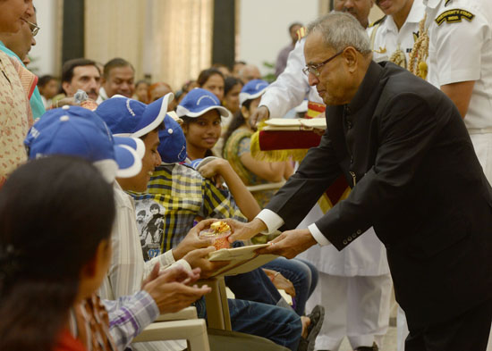 The President of India, Shri Pranab Mukherjee meeting the Physically and Mentally abled Children of President's Estate at Rashtrpati Bhavan Auditorium in New Delhi on August 15, 2013 on the occasion of Independence Day.