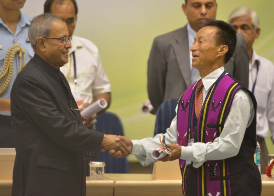 The President of India, Shri Pranab Mukherjee while presenting a National Award for the year 2012 on the occasion of Teachers’ Day at Vigyan Bhavan in New Delhi on September 5, 2013.