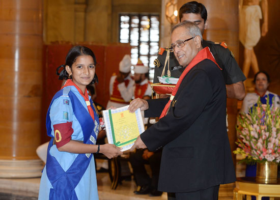 he President of India, Shri Pranab Mukherjeewhile presenting a Rashtrapati Scouts Award for the year 2010 and 2011 to a scout at the Durbar Hall of Rashtrapati Bhavan in New Delhi on September 9, 2013.