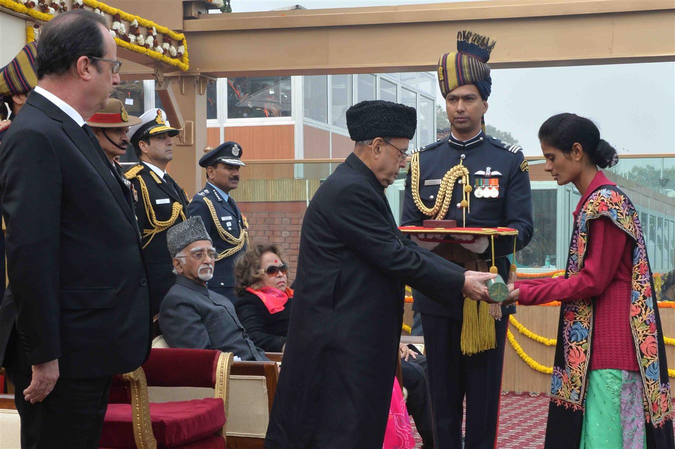 The President of India, Shri Pranab Mukherjee conferring the Ashoka Chakra (the highest peacetime gallantry award) posthumously on Lance Naik Mohan Nath Goswami of 9 Para (Special Forces)/6th Battalion of the Rashtriya Rifles at the 67th Republic Day Par 