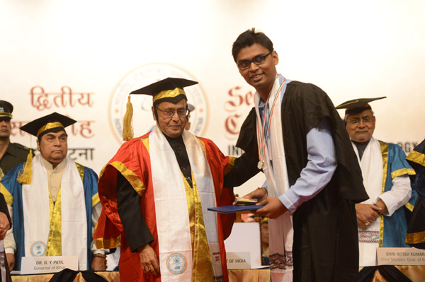 The President of India, Shri Pranab Mukherjee while presenting a degree to the student at the 2nd Convocation of Indian Institute of Technology (IIT) at Patna in Bihar on October 26, 2013.The Governor of Bihar, Dr. D. Y. Patil, and the Chief Minister of