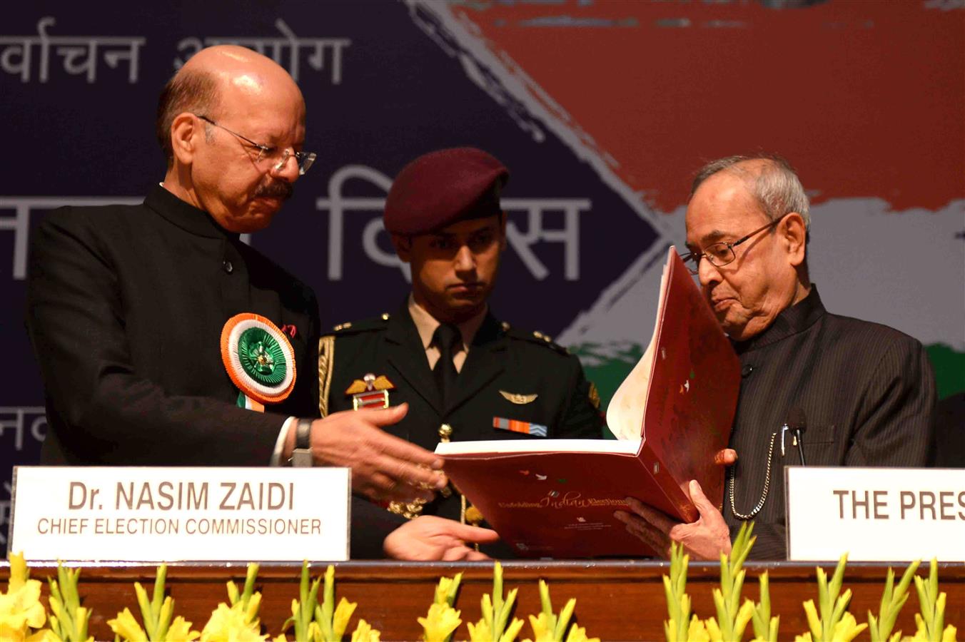 The Chief Election Commissioner of India, Dr. Nasim Zaidi releasing the Book ‘Unfolding Indian Elections - Journey of the living democracy’ and presenting the first copy to the President of India, Shri Pranab Mukherjee at the National Voters' Day Celebrat