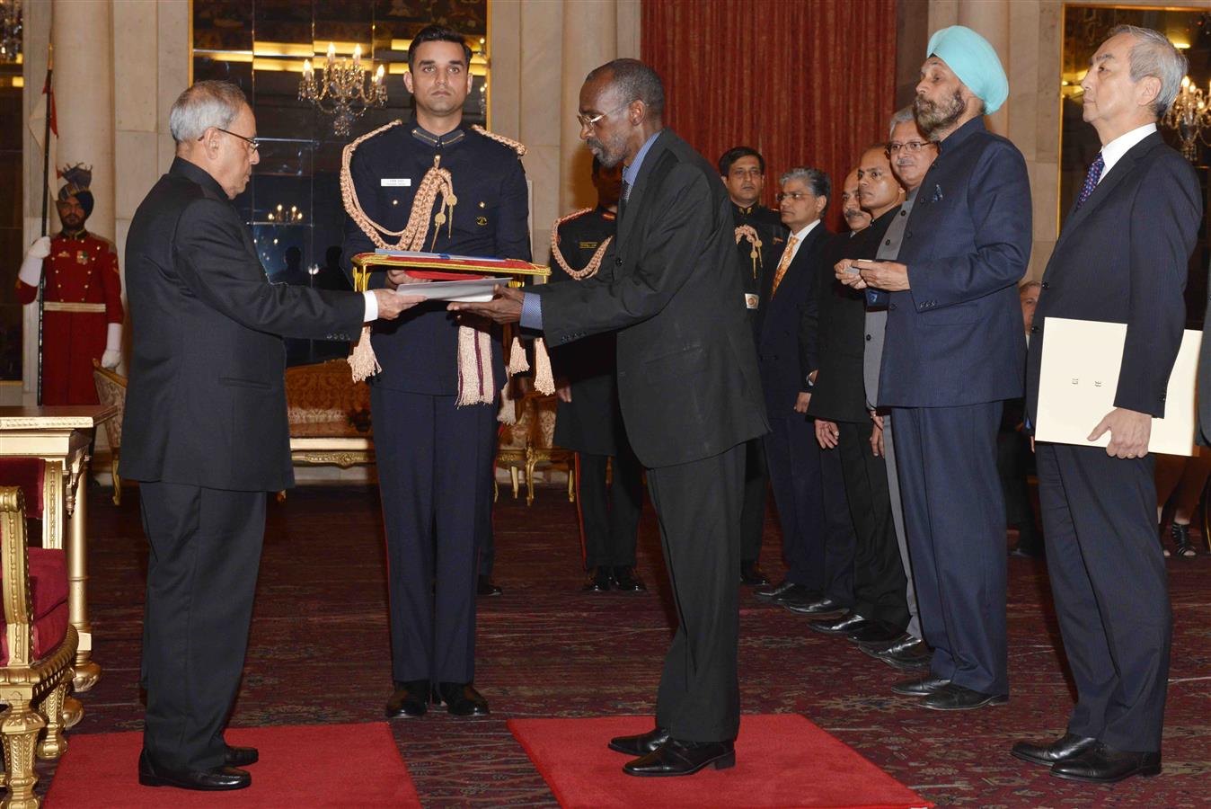 The Ambassador of Burkina Faso, H.E. Mr. Amadou Traore presenting his credential to the President of India Shri Pranab Mukherjee at Rashtrapati Bhavan on December 9, 2015.