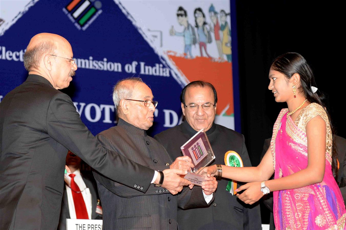 The President of India, Shri Pranab Mukherjee presenting the Election Photo Identify Cards [EPICs] to newly registered young voter at the National Voters' Day Celebration organized by the Election Commission of India in New Delhi on January 25, 2017.