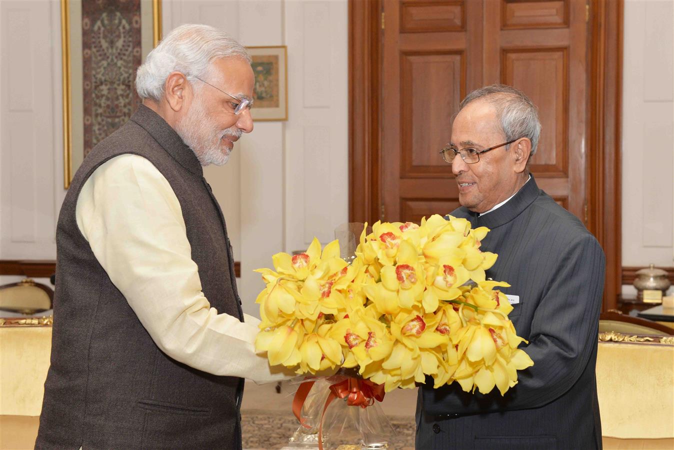 The Prime Minister of India, Shri Narendra Modi greeting the President of India, Shri Pranab Mukherjee on his Birthday at Rashtrapati Bhavan on December 11, 2015