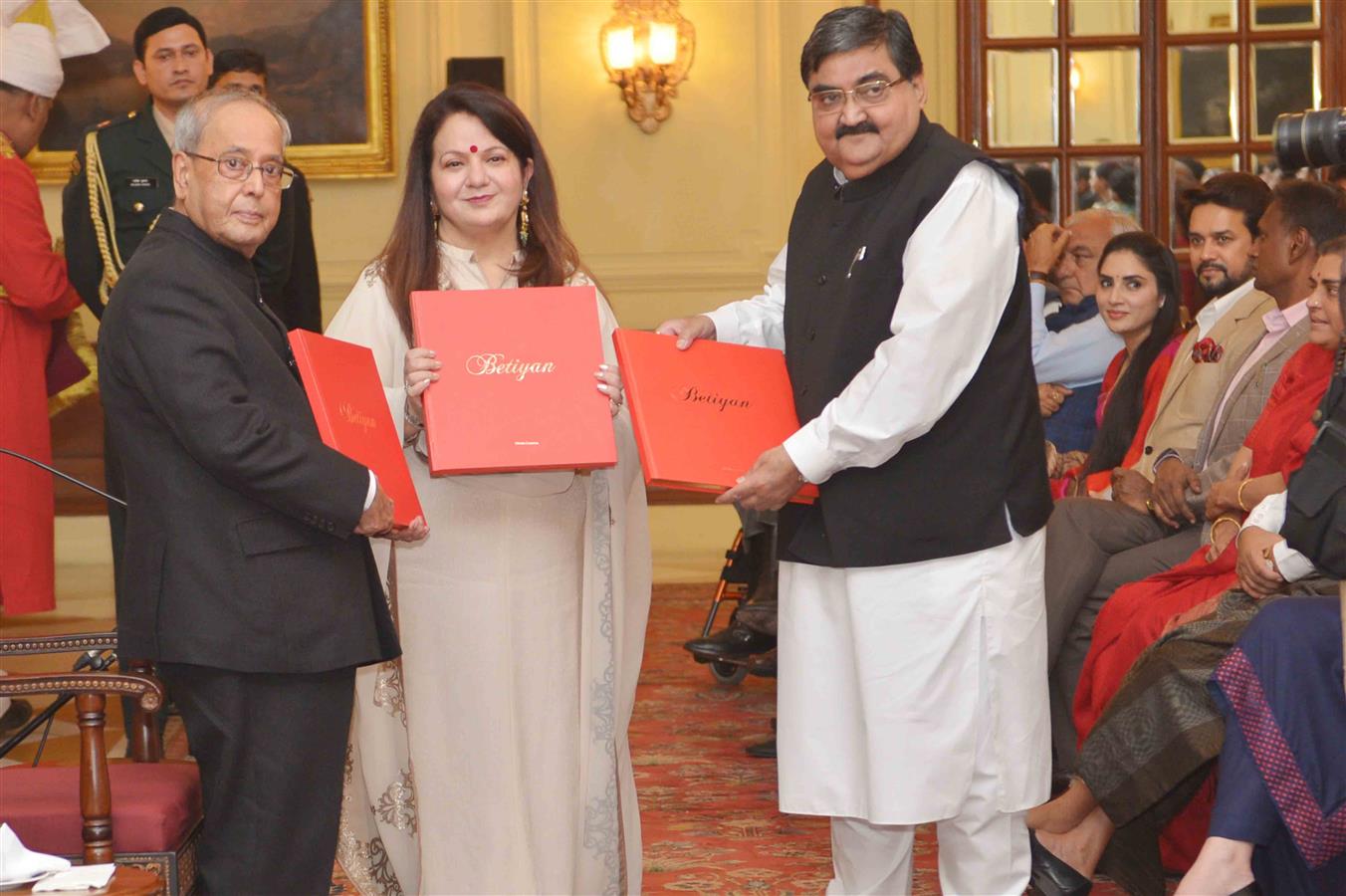 The President of India, Shri Pranab Mukherjee receiving the first copy of a coffee table book ‘Betiyan’ from Mrs. Kiran Chopra, Founder Chairperson, Varishth Nagrik Kesari Club at Rashtrapati Bhavan on December 2, 2016. 