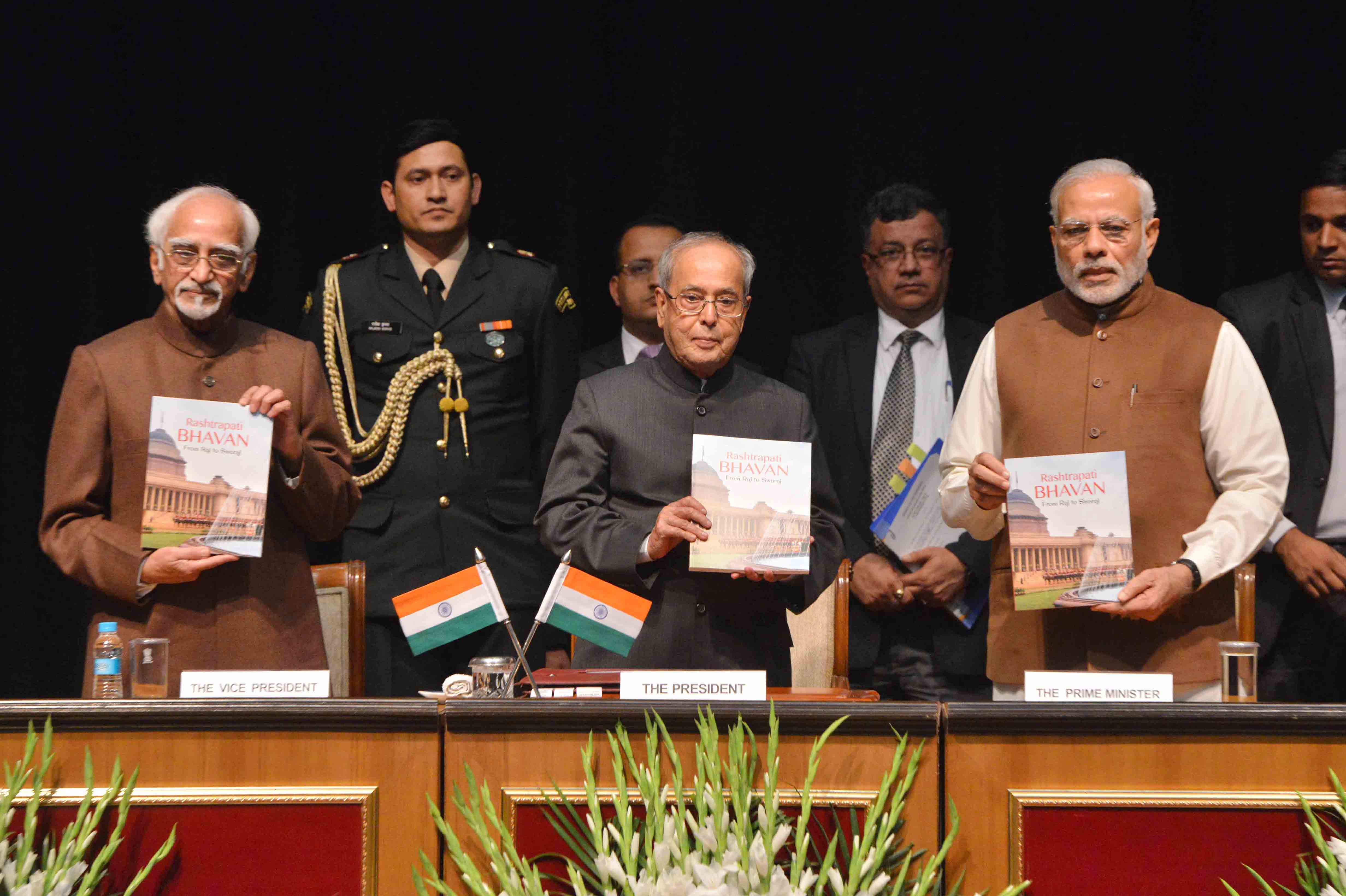 The Prime Minister of India, Shri Narendra Modi releasing a book entitled "Rashtrapati Bhavan: Raj to Swaraj" (Chidren Book Volum-II) and presenting first copy to the President of India, Shri Pranab Mukherjee at Rashtrapati Bhavan Auditorium on December 1 